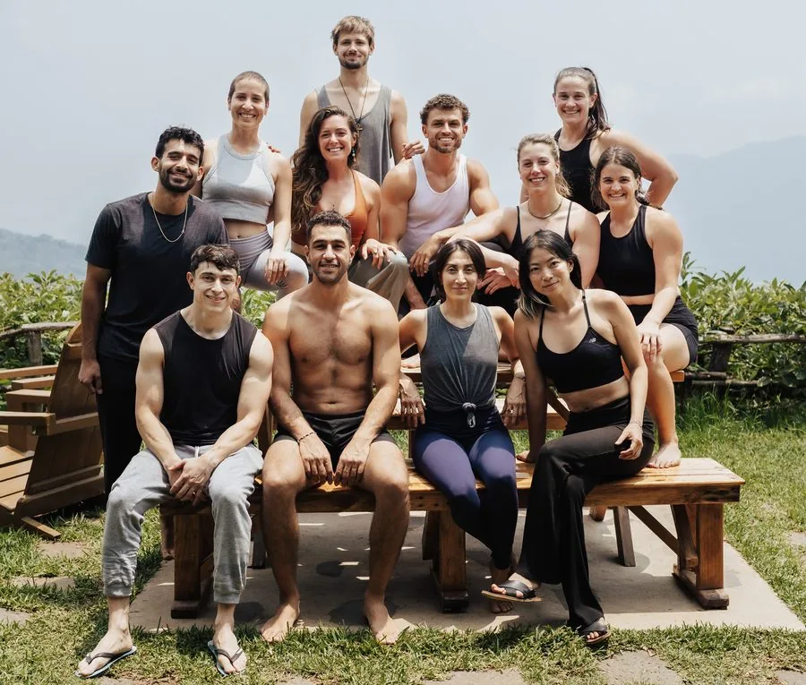 A group gathered outdoors together at a past workshop or retreat